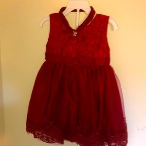 Beautiful baby dress. Red with a beautiful bow in the back. Head band included.